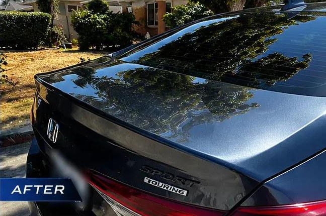 Rear of a dark Honda — after
